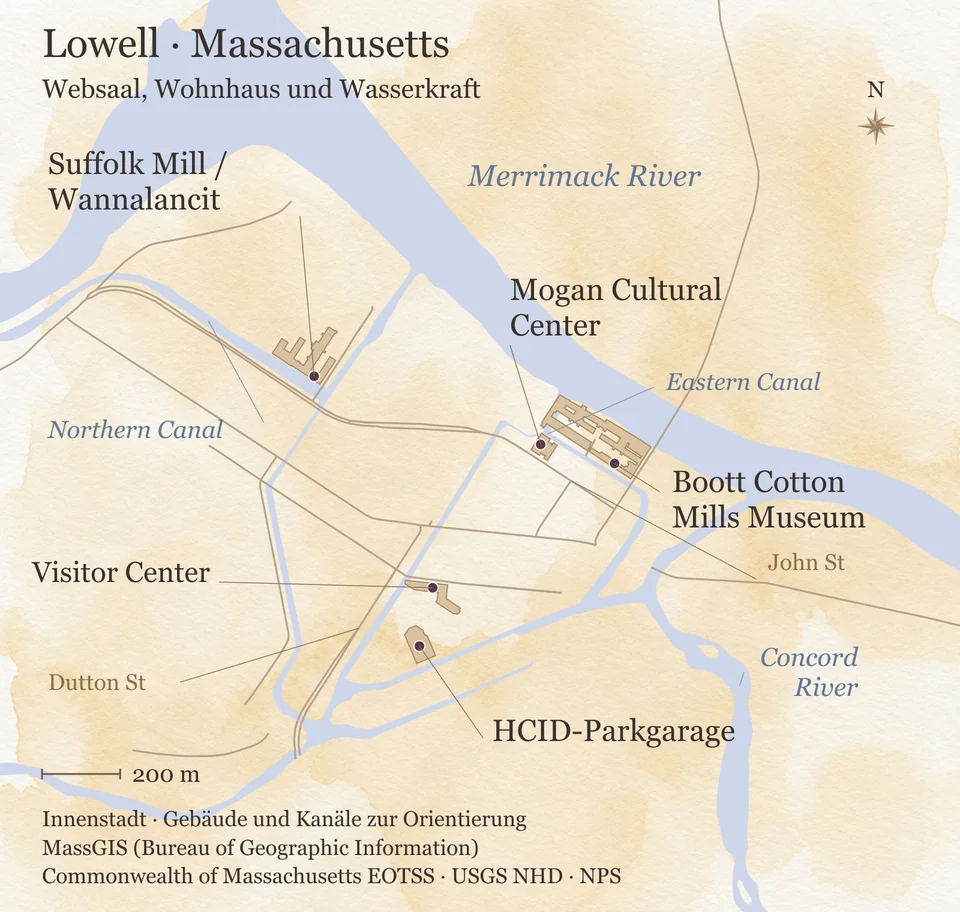 Orientierungskarte der Innenstadt von Lowell zwischen Merrimack River und Concord River: Boott Cotton Mills Museum und Mogan Cultural Center am Eastern Canal, die Suffolk Mill am Northern Canal, südlich davon Visitor Center und HCID-Parkgarage an der Dutton Street; Maßstabsleiste 200 Meter.